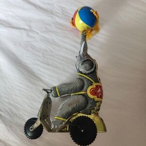 Vintage WIND-UP MOVING Elephant with Colorful Ball Tassles Spinning